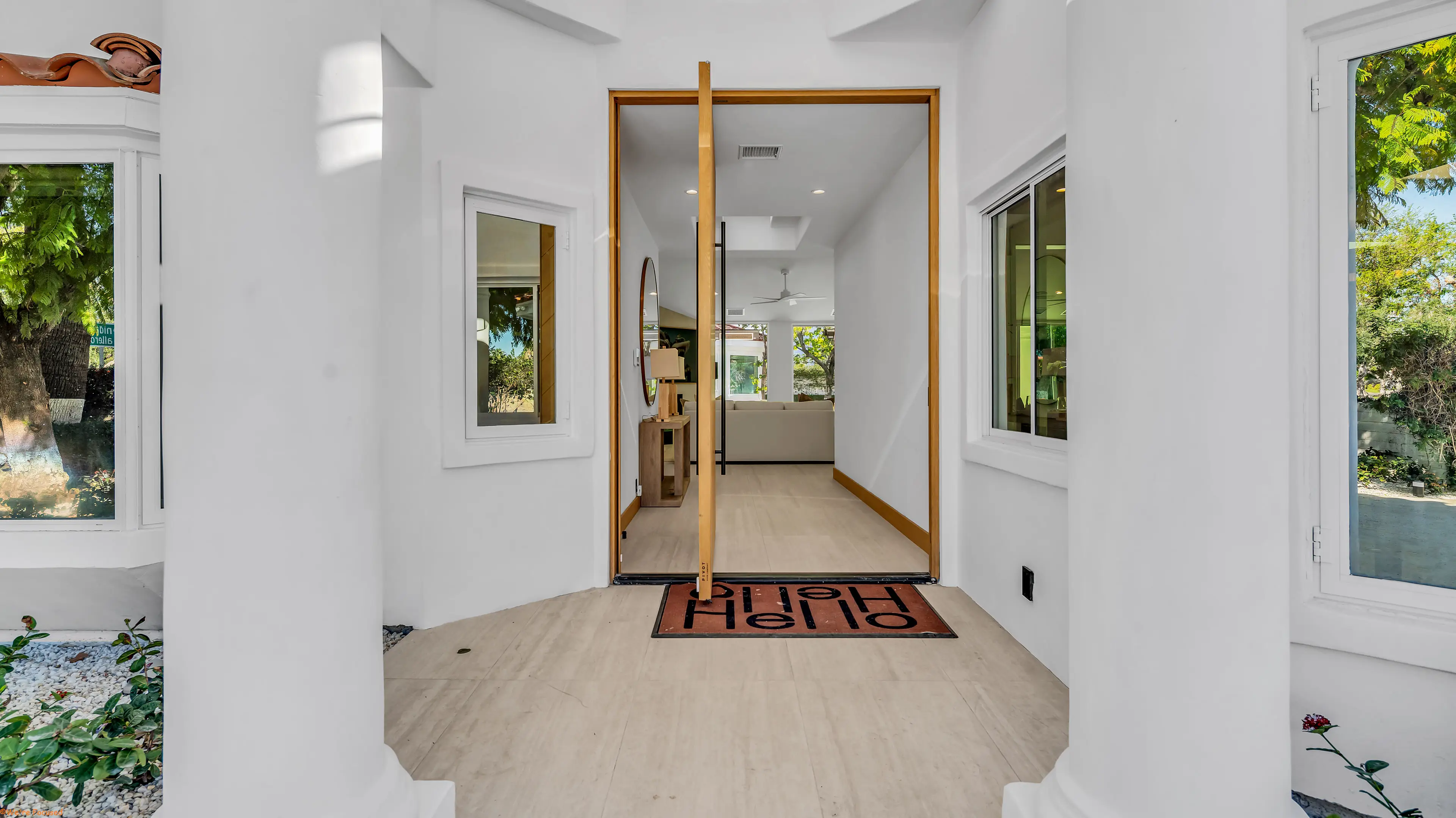 The entry hall looking through to the house, with light from both sides.